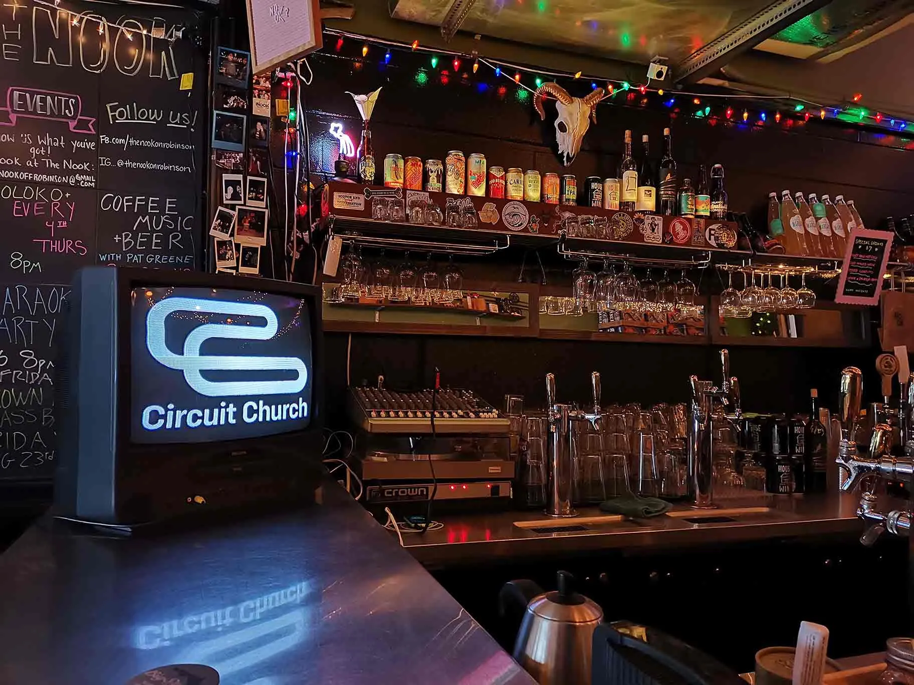 Image of the Circuit Church logo on a CRT TV on top of a counter at local Orlando bar The Nook on Robinson